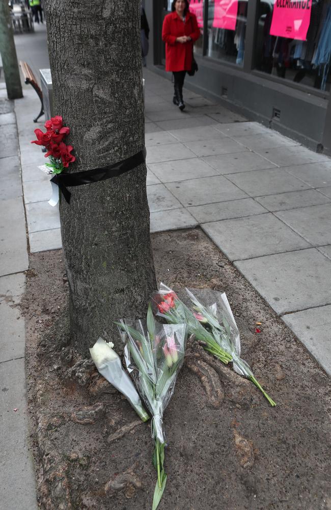 Several passers-by stopped to help the woman at the Chapel St site, where the tributes have been laid. Picture: David Crosling