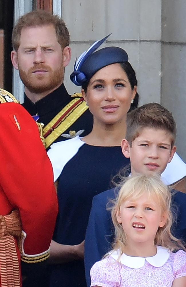 (L-R) Prince Harry, Duke of Sussex, Meghan, Duchess of Sussex, James, Viscount Severn and Isla Phillips stand for the Trooping the Colour, Meghan’s first outing since maternity leave. Picture: AFP