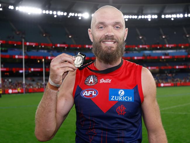 MELBOURNE, AUSTRALIA - APRIL 24: Max Gawn of the Demons poses with the Frank 'Checker' Hughes medal during the 2025 AFL Round 07 match between the Melbourne Demons and the Richmond Tigers at the Melbourne Cricket Ground on April 24, 2025 in Melbourne, Australia. (Photo by Michael Willson/AFL Photos via Getty Images)