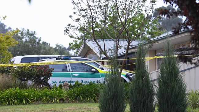 Police and an ambulance in the driveway of the home after the attack in 2017. Picture: Brenton Edwards