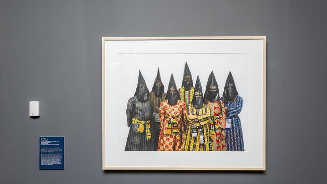 People of dark skin pictured wearing Klu Klux Klan style hoods. Art by Dr Fiona Foley. Photo: John Wilson