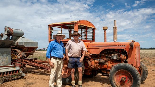 Quambatook Heritage Working Machinery Association members Ian Fisher (left) and Ian 'Darby' Munro in front of LA Case tractor and Sunshine no. 4 header. Picture: Kerry McFarlane