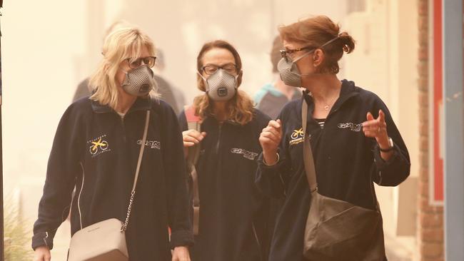 Smoke masks are in high demand in Mallacoota. Picture: David Caird