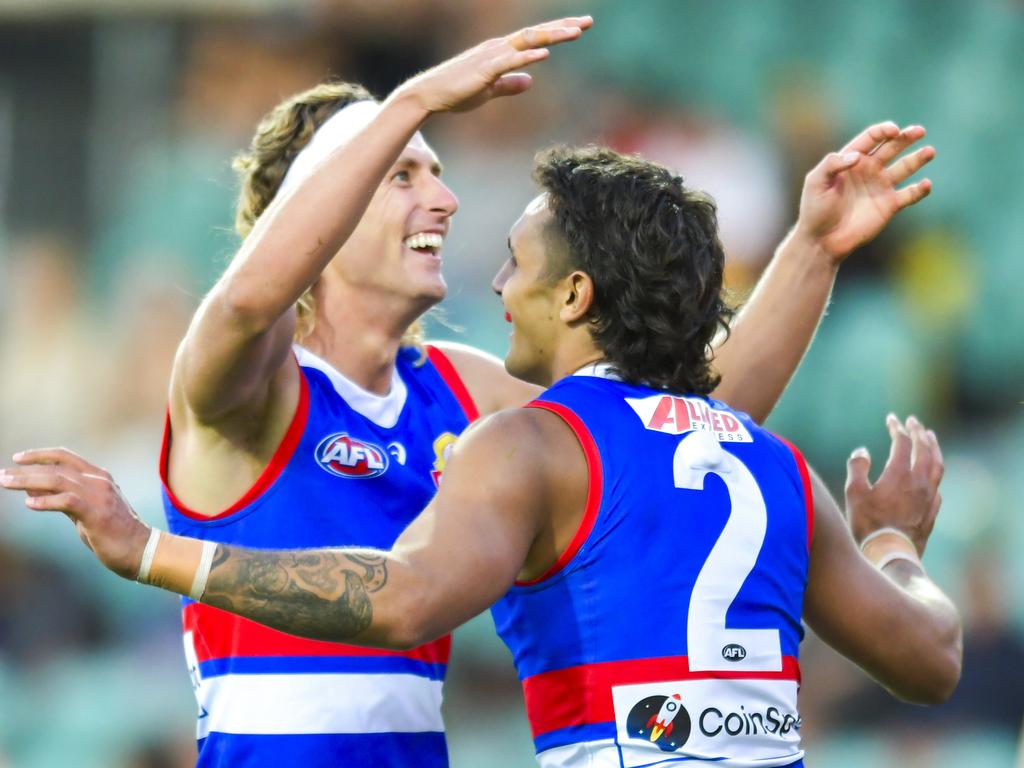 Aaron Naughton and Jamarra Ugle-Hagan celebrate a Bulldogs goal. Picture: Simon Sturzaker/Getty Image