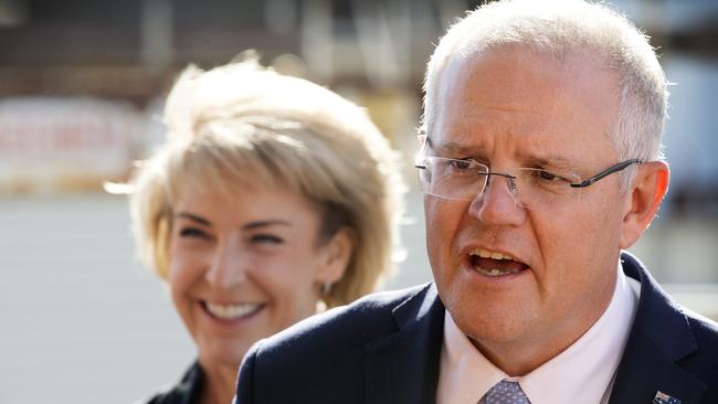 Scott Morrison and Michaelia Cash hope their plan to have businesses and government pay debts within 20 days of invoice will boost employment. Picture: CHRIS KIDD