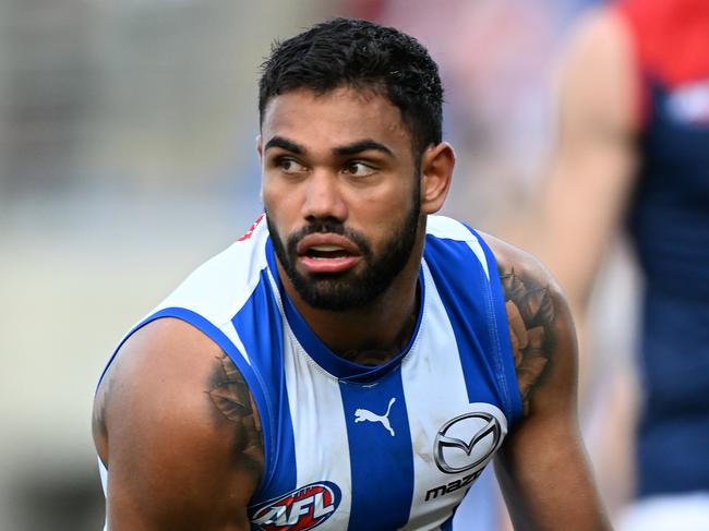 HOBART, AUSTRALIA - AUGUST 06: Tarryn Thomas of the Kangaroos runs the ball during the round 21 AFL match between North Melbourne Kangaroos and Melbourne Demons at Blundstone Arena, on August 06, 2023, in Hobart, Australia. (Photo by Steve Bell/Getty Images)