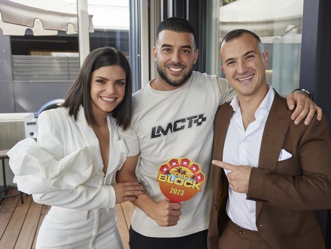 Steph and Gian with Adrian Portelli after he bought their house. Picture: Channel 9