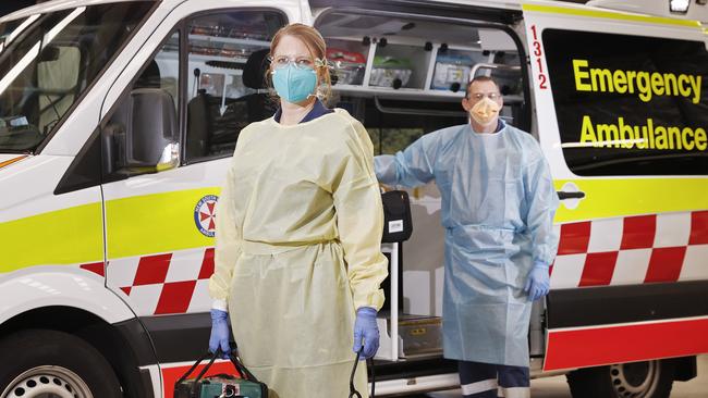 Paramedics in Blacktown done their PPE before they start a shift in September 2021. Picture: Sam Ruttyn