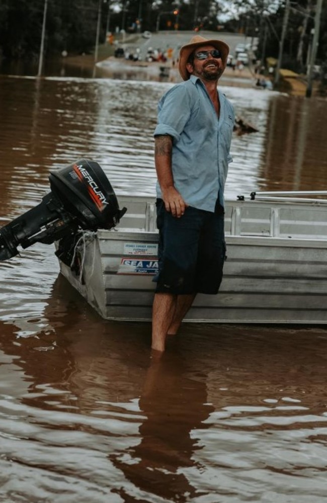 "Dinghy Dan'' Hill at Moggill Rd in the flood. Picture: Allie Lee