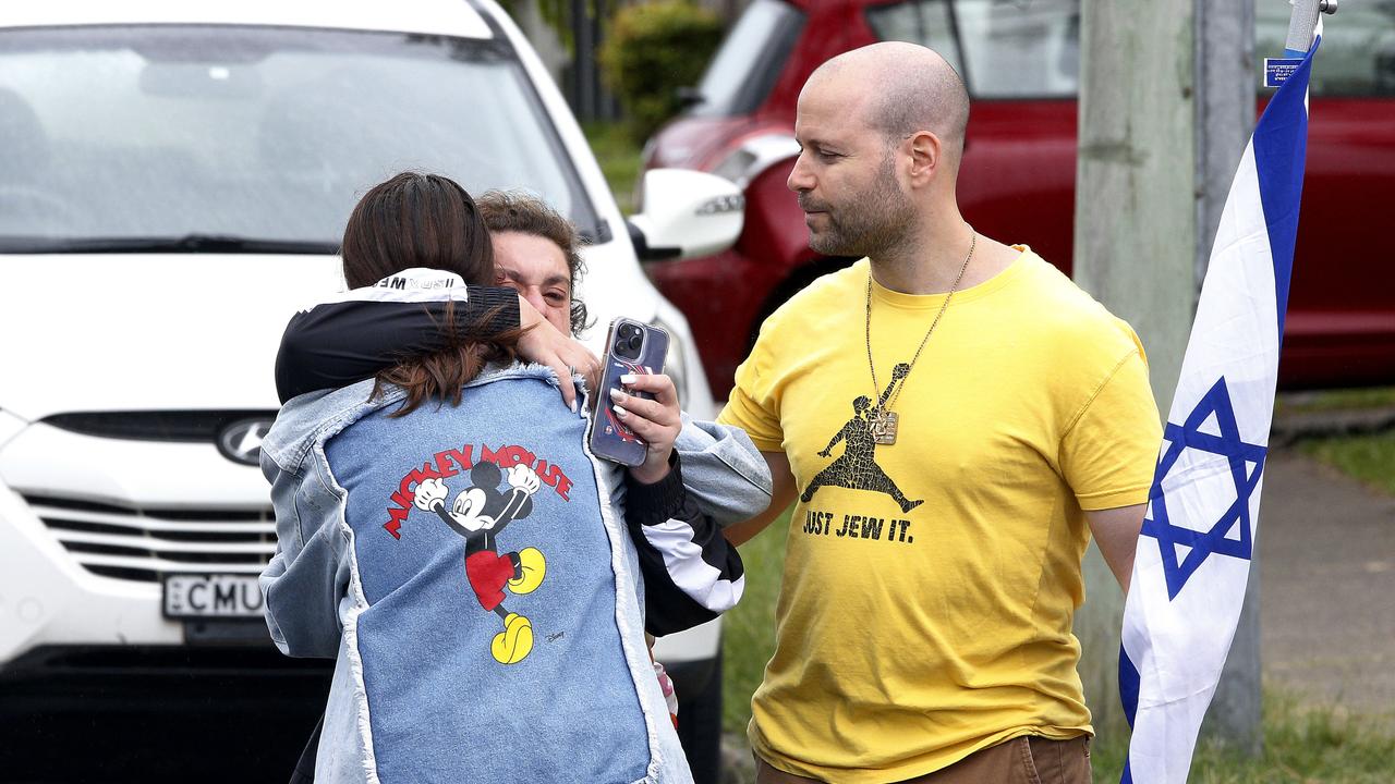 Distraught community members at the scene after an anti-Semitic act of vandalism in Dover Heights, where a car was burned and a house sprayed with red paint. Picture: NewsWire / John Appleyard