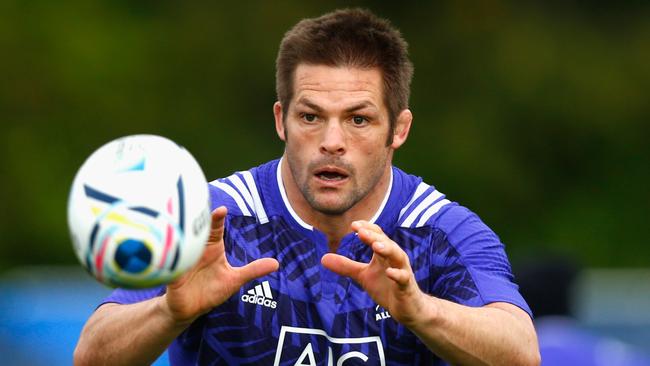 Richie McCaw of the All Blacks takes a pass during a training session at Lensbury.