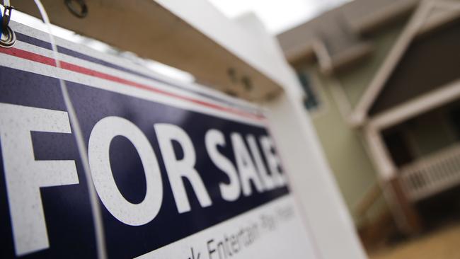 In this Tuesday, Jan. 26, 2016, photo, a "For Sale" sign hangs in front of an existing home in Atlanta. On Thursday, Feb. 11, 2016, Freddie Mac reports on the week’s average U.S. mortgage rates. (AP Photo/John Bazemore)