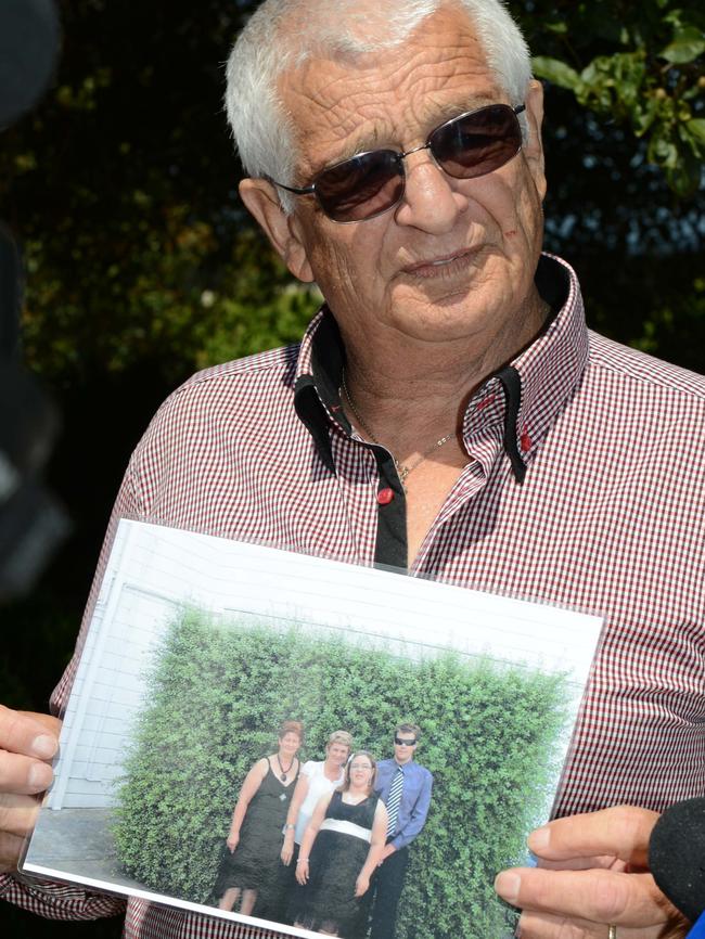 Bev Khan’s husband, Charles Khan, pictured outside the Mount Gambier District Court with a family photo after giving a victim impact statement. Picture: Lechelle Earl.