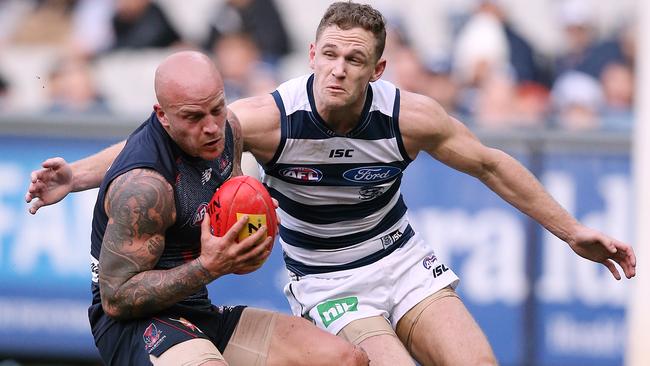 Joel Selwood looks to wrap up Nathan Jones. Picture: Wayne Ludbey