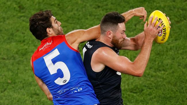 Mitch McGovern marks in front of Christian Petracca. Picture: Michael Willson/AFL Photos via Getty Images