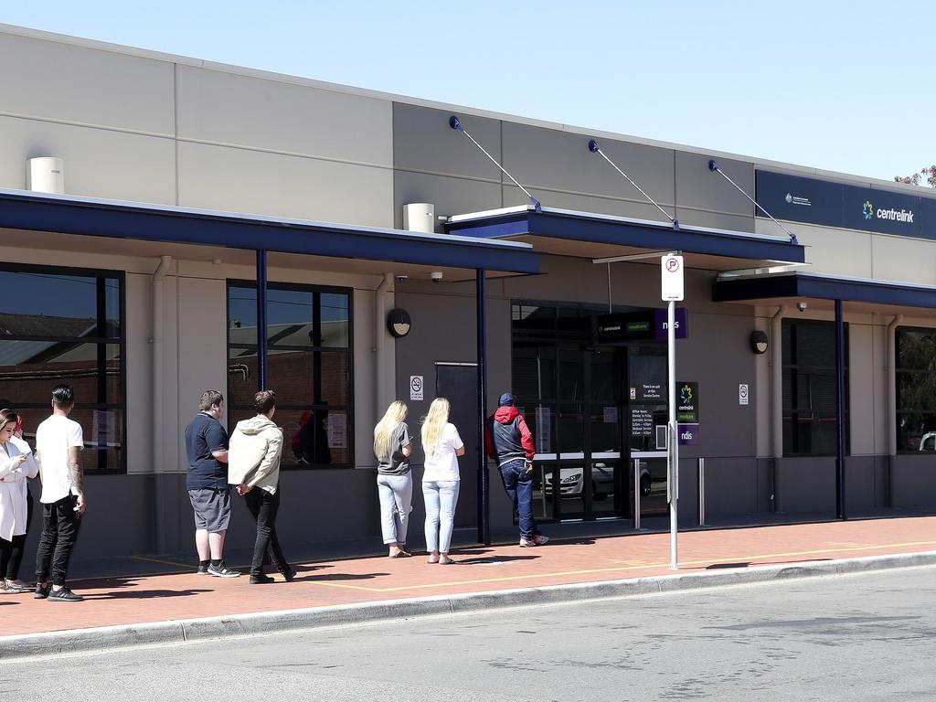 People standing outside the Centrelink office in Port Adelaide. Picture Sarah Reed