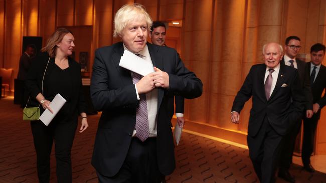 Former Prime Ministers (L-R) Boris Johnson and John Howard arrive at the John Howard Lecture for the Menzies Research Centre. Picture: Jane Dempster