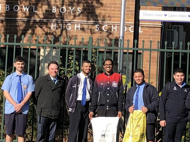 #DOSOMETHING DAY: Punchbowl Boys High School principal ROBERT PATRUNO with students and staff Mariam Sabih (science teacher) and Francis Francis Floresca (english teacher) Picture: Lawrence Machado