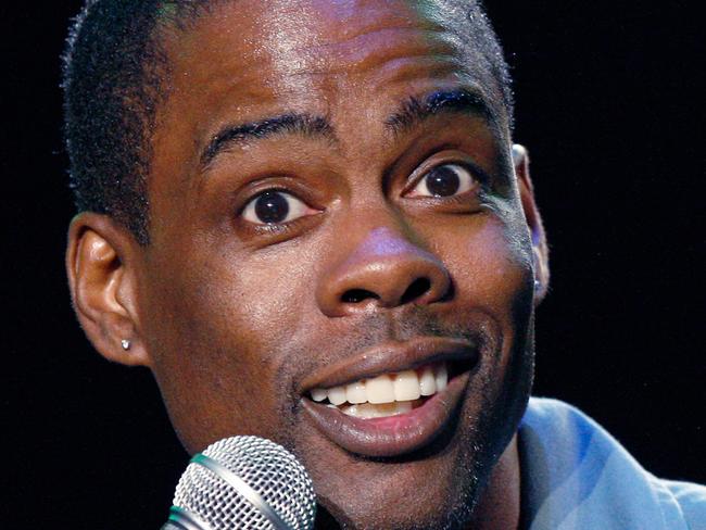 ** FILE ** In this June 13, 2008 file photo, Chris Rock performs at the Bonnaroo Music and Arts Festival 2008 in Manchester, Tenn. The award-winning comedian has a deal with Grand Central Publishing for a book, currently untitled but full of 