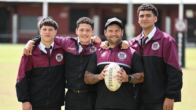 Adaquix Luke, second from the left, with his dad and former NRL champion Isaac Luke and other Marsden SHS boys.