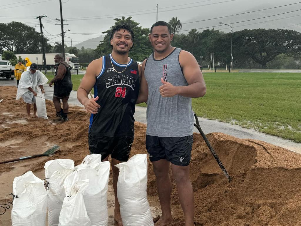 Cowboys players Jeramiah Nanai and Viliami Vailea were a pair of floody legends on Saturday, spending hours helping people fill sandbags at Hermit Park. Picture Instagram