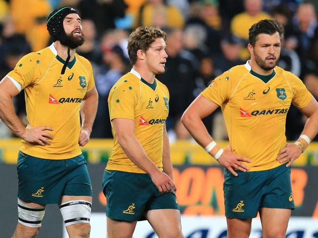 Wallabies players leave the field after the heavy loss. Picture: Mark Evans