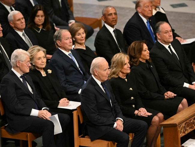 TOPSHOT - From L to R, front row, US President Joe Biden, First Lady Lady Jill Biden, Vice President Kamla Harris, Second Gentleman Doug Emhoff, second row, former President Bill Clinton, former Secretary of State Hillary Clinton, former President George W. Bush, his wife Laura Bush, former President Barack Obama, President-elect Donald Trump and his wife Melania Trump attend the State Funeral Service for former US President Jimmy Carter at the Washington National Cathedral in Washington, DC, on January 9, 2025. (Photo by Mandel NGAN / AFP)