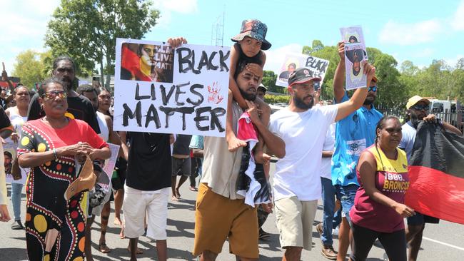 Algen Donahue leads a march through the streets of Mareeba after his twin brother was shot dead on Saturday. Picture: Peter Carruthers