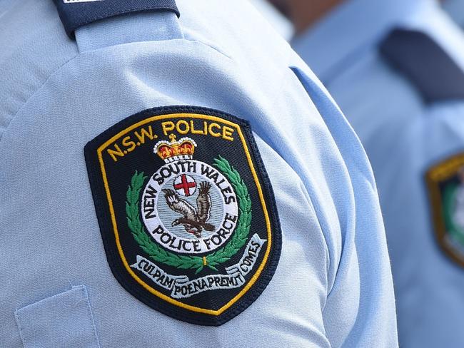 Stock image of New South Wales Police badges in Sydney, Friday, Aug. 16, 2013.  (AAP Image/Dean Lewins) NO ARCHIVING