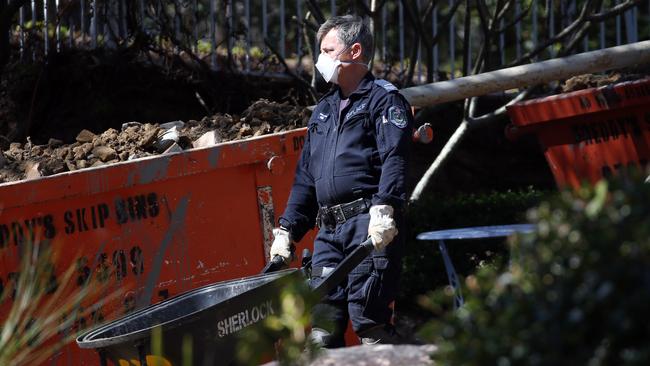 Police shift soil during the search. Picture: Jane Dempster.