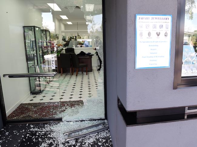 Broken glass where the robbers smashed their way into Jafari Jewellery. Picture: Josie Hayden