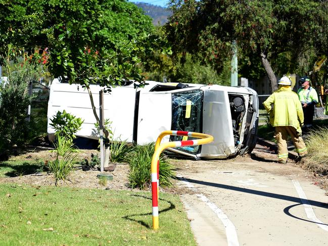 Emergency Services respond to a Holden ute that rolled on its side after an alleged road rage incident on Nathan St, Heatley. Picture: Alix Sweeney