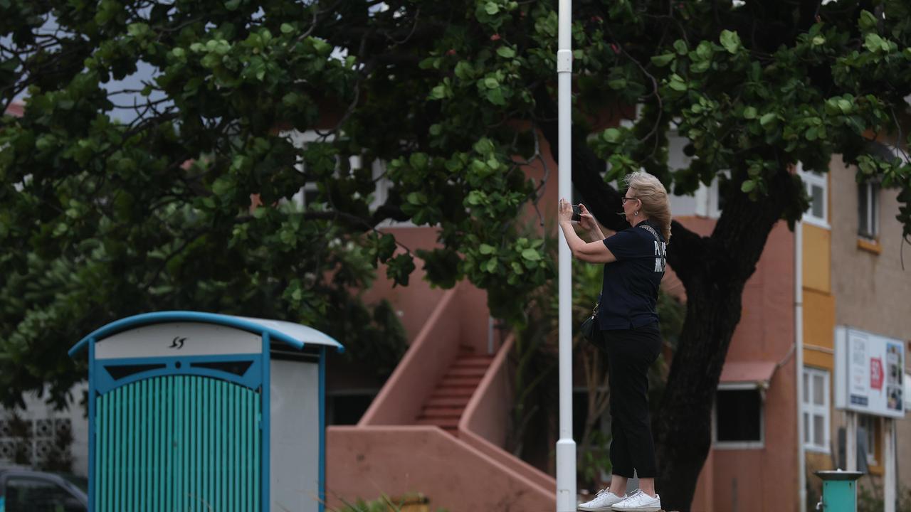 Townsville locals woke early to inspect the damage along The Strand left from TC Kirrily that hit overnight. Picture: Adam Head