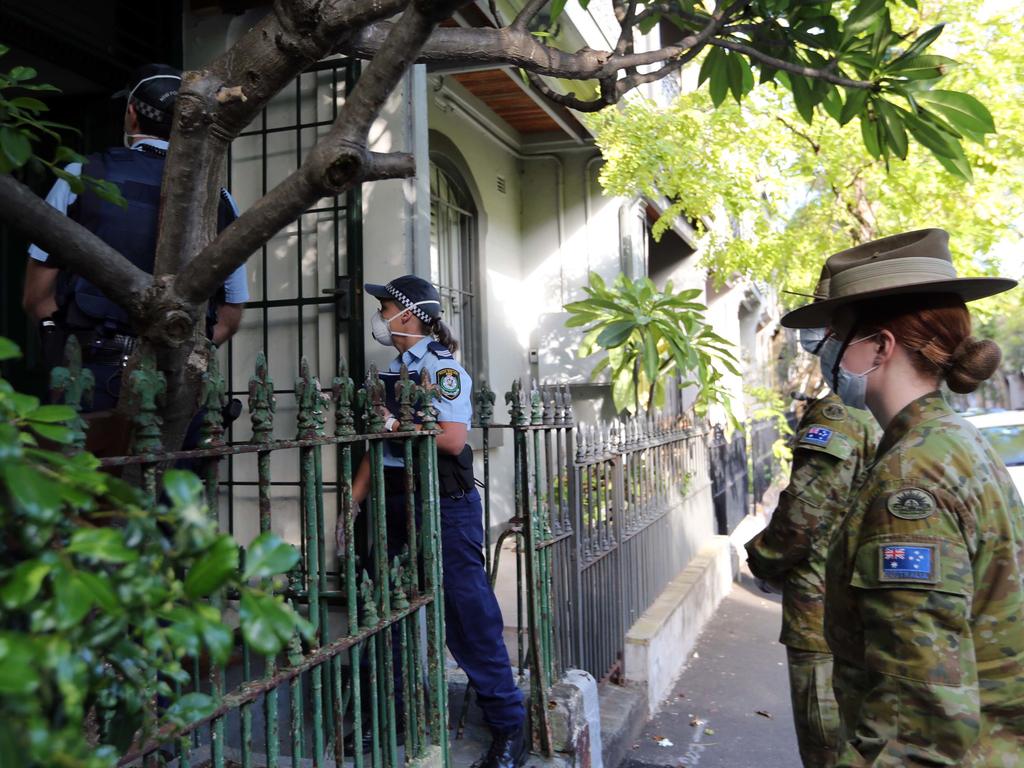 NSW Police Force and the Australian Defence Force conducting Public Health Order checks at homes and businesses in Sydney. Picture: NSW Police