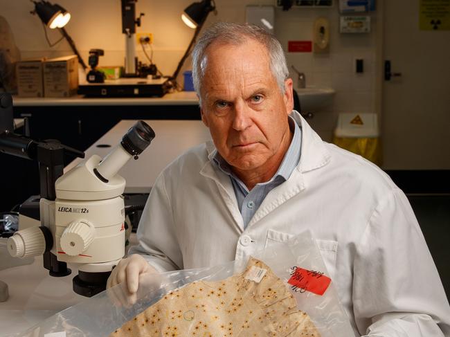 SAWeekend of Prof Chris Pearman, retiring director of Forensic Science SA on November 15, 2020.  Prof Pearman is holding the pyjama top worn by Louise Bell when she was abducted in 1983.  in Adelaide. Picture Matt Turner.