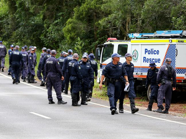 Police from Stike Force Rosann and the Public Order and Riot Squad prepare to search bush land along Long Point Trail near Bonny Hills. Picture: Nathan Edwards