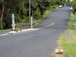 Flowers on Cecil St, Nimbin, where a pedestrian was fatally struck by a vehicle in an alleged hit-and-run incident On Monday, April 15. Picture: Liana Turner