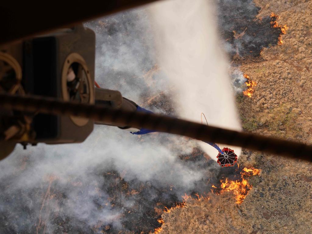 A Hawaii Army National Guard CH47 Chinook performs aerial water bucket drops on wildfires on the Hawaiian island of Maui. Picture: AFP