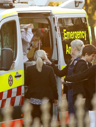 The baby is assessed by paramedics at Willmot. Picture: Justin Sanson