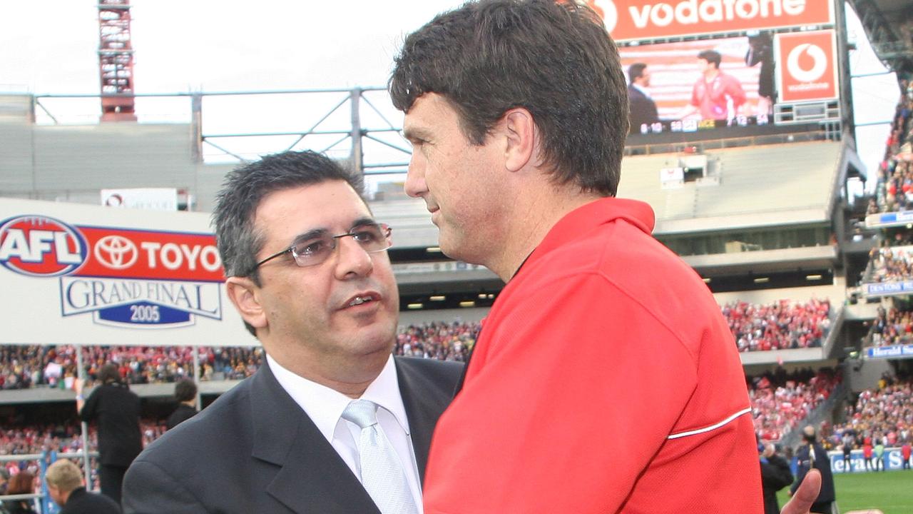 Swans Coach Paul Roos shakes hands with AFL CEO Andrew Demetriou. Photo by Quinn Rooney/Getty Images.