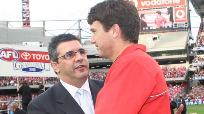 Swans Coach Paul Roos shakes hands with AFL CEO Andrew Demetriou. Photo by Quinn Rooney/Getty Images.