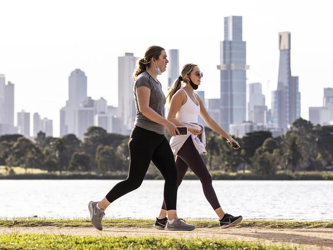 MELBOURNE, AUSTRALIA - JUNE 02: People are seen exercising at Albert Park Lake on June 02, 2021 in Melbourne, Australia. Lockdown restrictions have been extended for another seven days as new COVID-19 cases continue to emerge linked to the current community cluster. Residents can only leave home for five reasons: care and caregiving, exercise, work and to buy groceries, or to get vaccinated, but can now travel within a 10km radius from home. (Photo by Daniel Pockett/Getty Images)