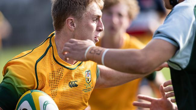 Patrick Broe runs into a crowd. Picture: Julian Andrews