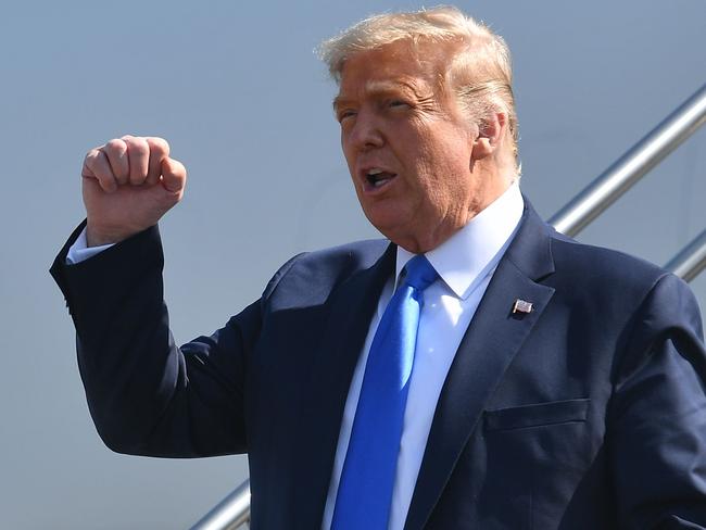 US President Donald Trump steps off Air Force One upon arrival at John Wayne Airport in Santa Ana, California on October 18, 2020. - Trump is heading to Newport Beach, California a fundraiser. (Photo by MANDEL NGAN / AFP)