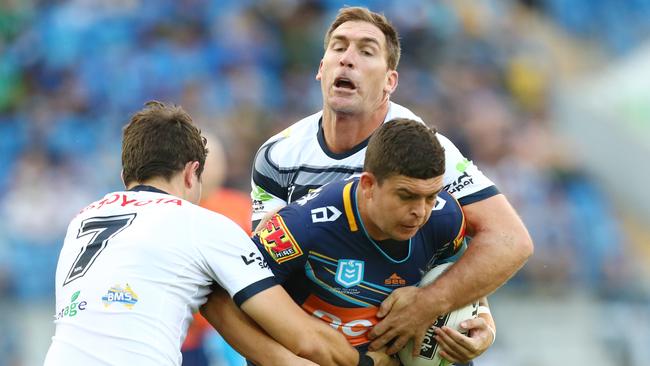 Taylor is wrapped up by Cowboys defenders. Picture: Getty Images