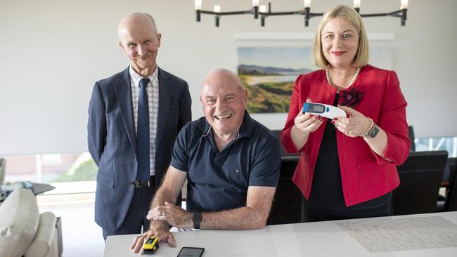 Home owner Terry Field, centre demonstrates the new Covid@home technology with state health commander Kathrine Morgan-Wicks and regional health commander for Covid Stephen Ayre. Picture: Eddie Safarik