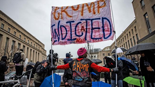 Protestors and members of the press gather outside the E Barrett Prettyman federal courthouse in Washington. Picture: Getty Images