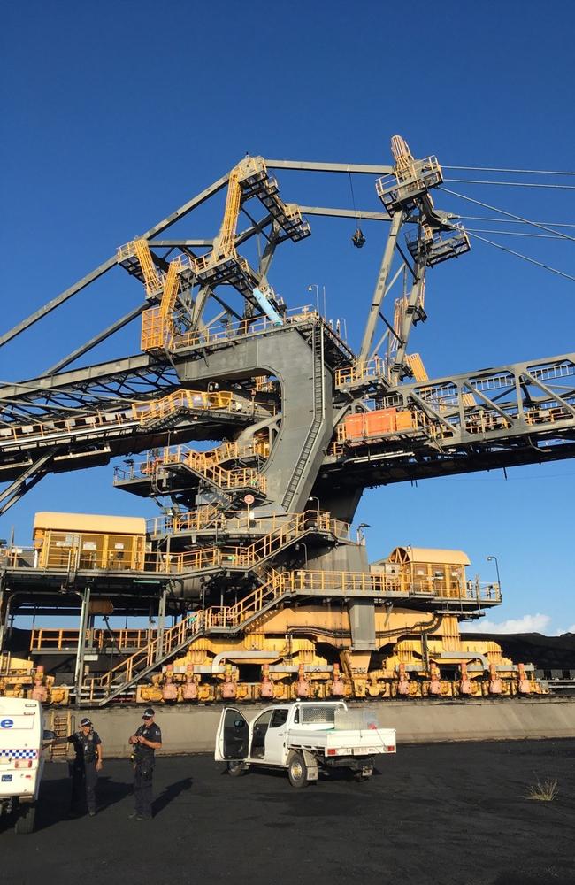 Paul Jukes suspended from the stacker reclaimer at the North Queensland Export Terminal.