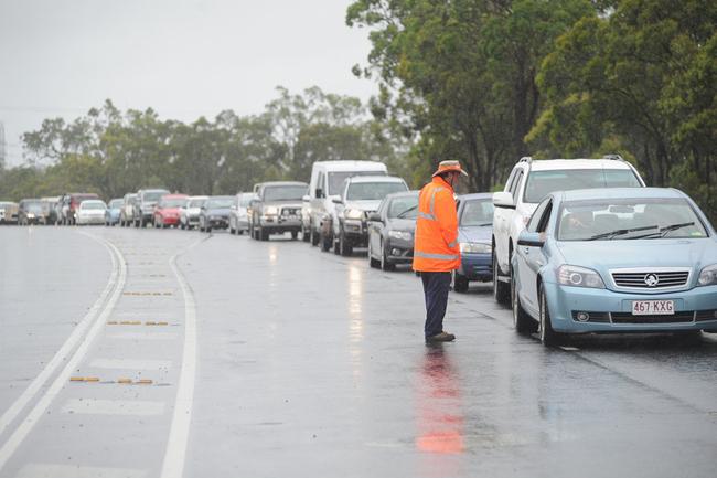 Fraser Coast flooding - traffic waits outside Sexie Coffee on the Bruce Highway north of Maryborough for flood waters near Aldershot to subside. Photo: Alistair Brightman / Fraser Coast Chronicle. Picture: Alistair Brightman