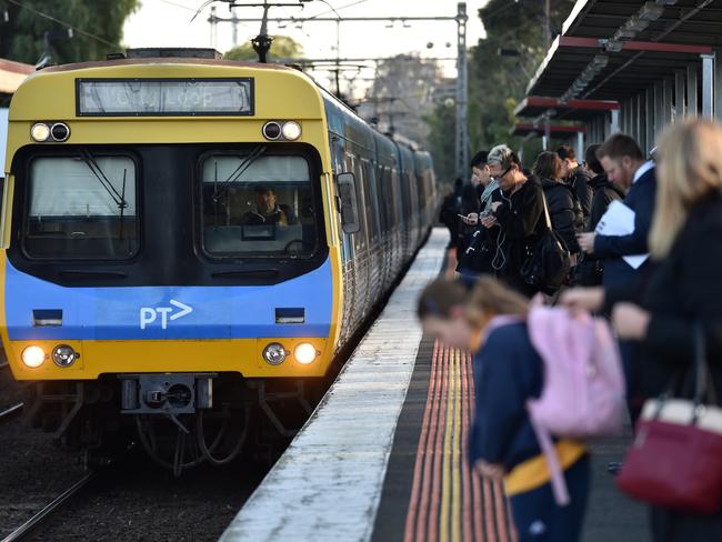 Peak hour commuters wait for a city loop train at Newmarket Station ahead of a train strike in Melbourne, Friday, Sept. 4, 2015. Close to 700 train services will be cancelled across Melbourne on Friday as part of the Rail, Train and Bus Union's rolling industrial action against Metro Trains. (AAP Image/Tracey Nearmy) NO ARCHIVING